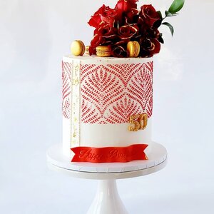 I've been so excited to post this beauty! Over the past few months, I've seen several cake artists use this stencil, which made me eager to get one of my own. I definitely waited too long. It's gorgeous. 

This customer was in need of an elegant, age